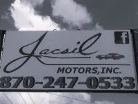 a sign with a message that says jacsil motors inc. and a facebook logo with phone number